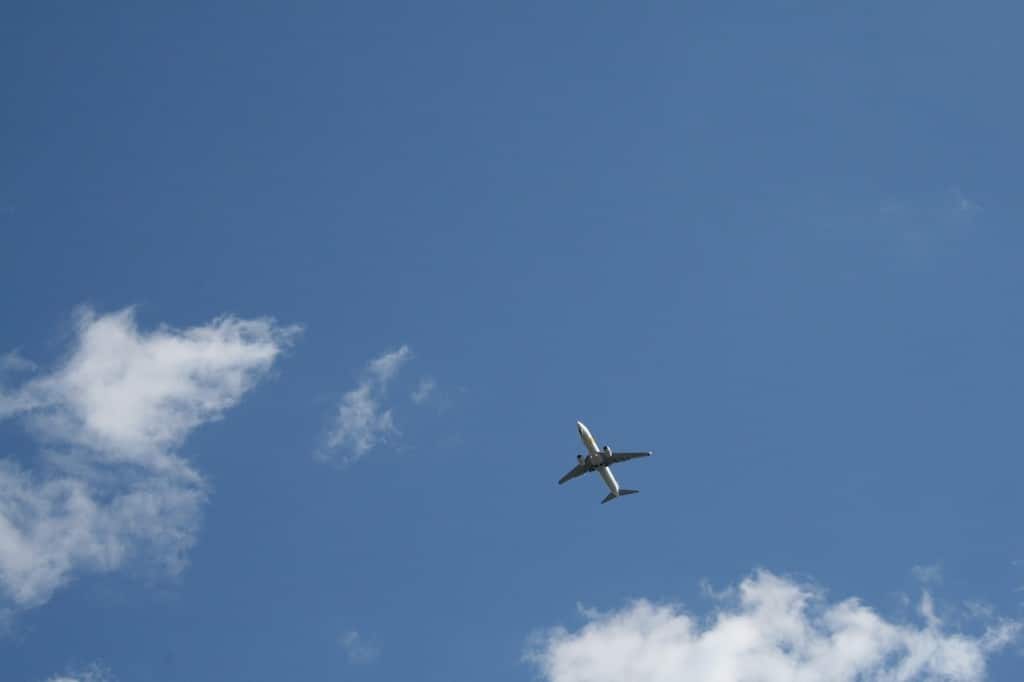 A cloud and plane in the sky