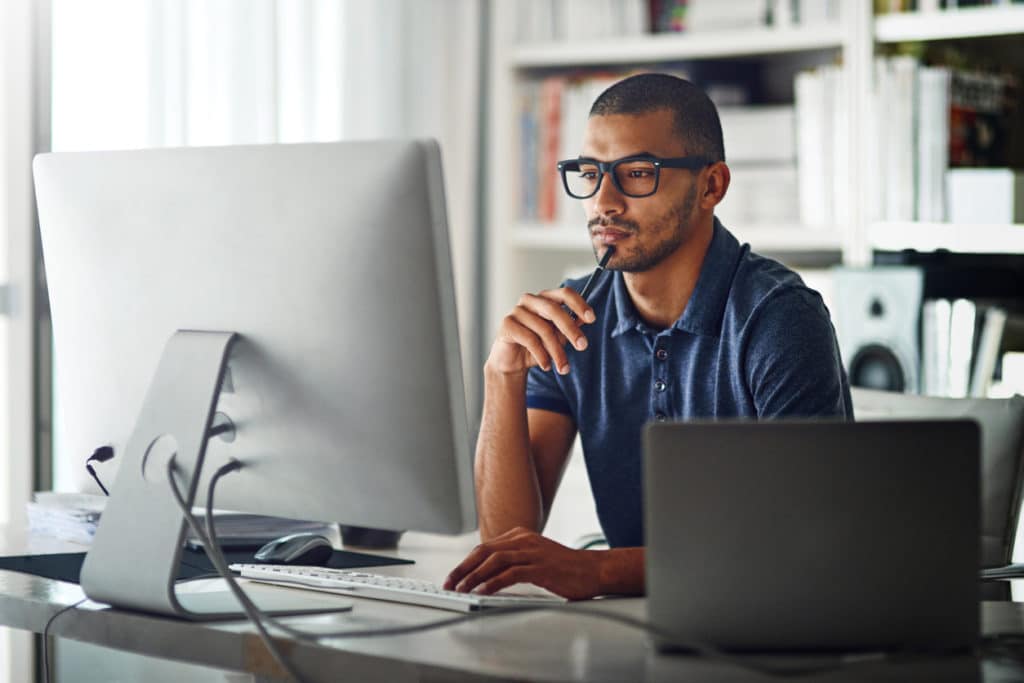 A businessman doing remote work in his home office.